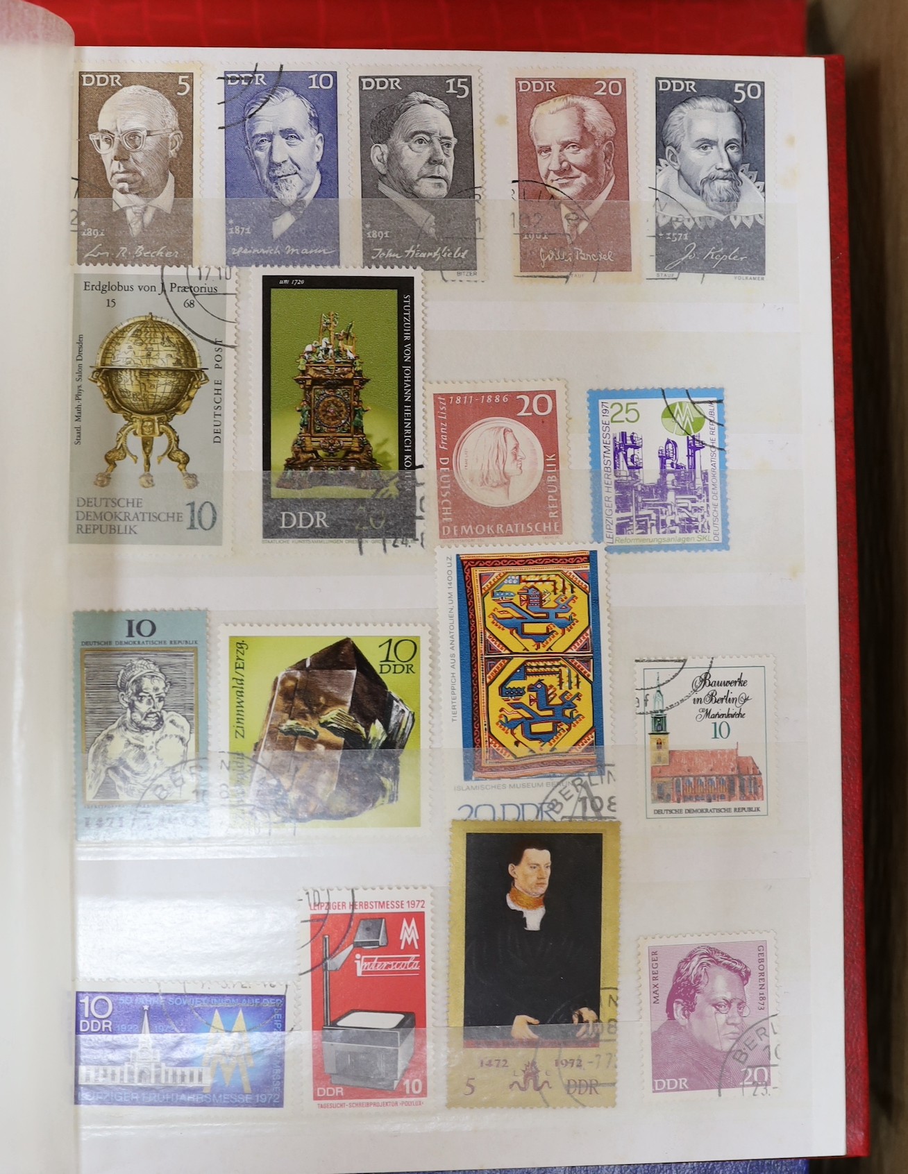 Four stock books of British stamps, QEII mint unused definitives and stamp books, some pre-decimal and two stock books of DDR used and mint unused stamps